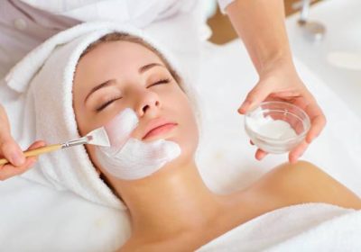 Woman in mask on face in spa beauty salon.